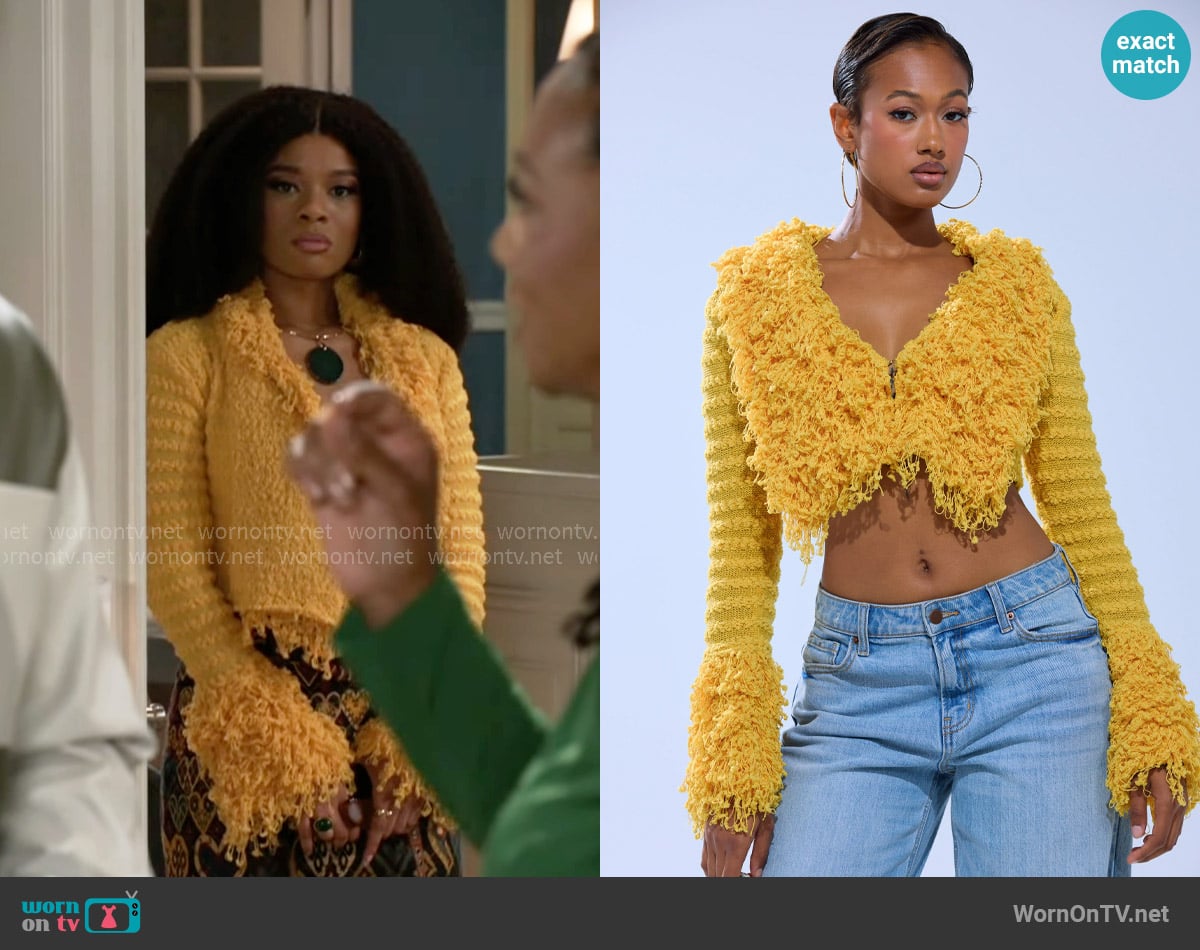 Akira Sunshine Queen Fringe Sweater worn by Eva Thomas (Ambyr Michelle) on Beyond the Gates