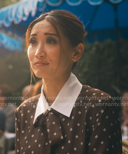 Ali’s brown printed top with white collar on Running Point