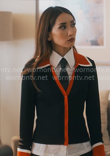 Ali’s cardigan with red trims on Running Point