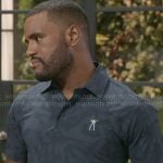 Andre’s golf polo shirt on Beyond the Gates