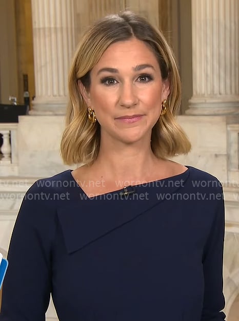 Caitlin Huey-Burns’ navy asymmetric neckline dress on CBS Mornings