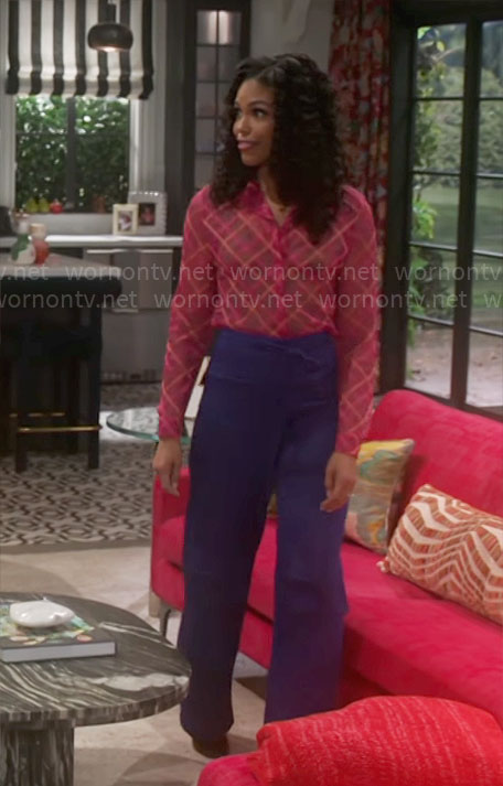 Dani’s pink sheer plaid shirt and purple cargo pants on Beyond the Gates