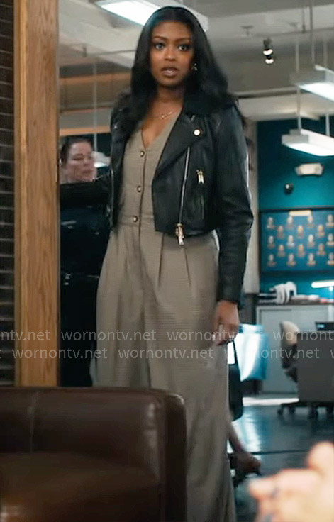 Daphne’s checked v-neck jumpsuit and leather jacket on High Potential