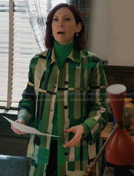 Elsbeth’s green abstract print coat on Elsbeth