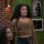 Eva’s olive textured top and striped jeans on Beyond the Gates