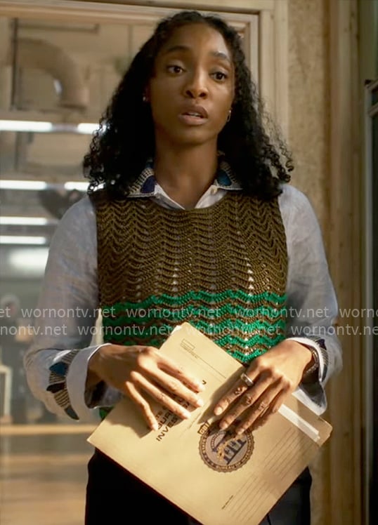 Faith’s light blue shirt and green knit vest on Will Trent