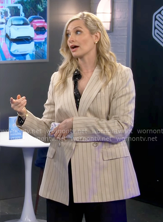 Gemma’s black and white dotted shirt and beige pinstripe blazer on The Neighborhood