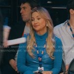 Isla’s blue dress with leather waist on Running Point