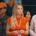 Isla’s red cap-sleeve belted drses on Running Point