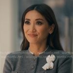 Ali’s grey cardigan with flower applique on Running Point