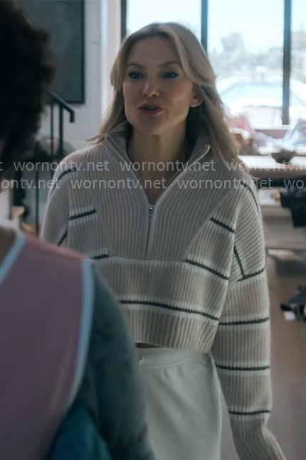 Isla’s beige striped quarter zip sweater on Running Point