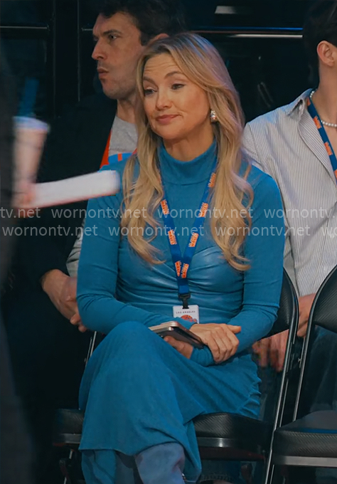 Isla’s blue dress with leather waist on Running Point