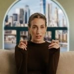 Amanda’s brown long sleeve confessional top on In The City