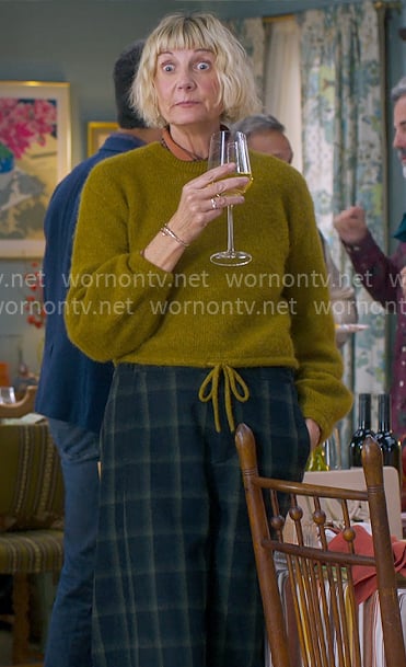 Anne’s olive tie hem sweater and checked pants on The Four Seasons