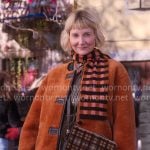 Anne’s orange fleece jacket and green cord midi skirt on The Four Seasons