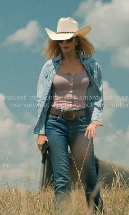 Beth’s pink tank top and denim shirt with brown suede bag on Dutton Ranch