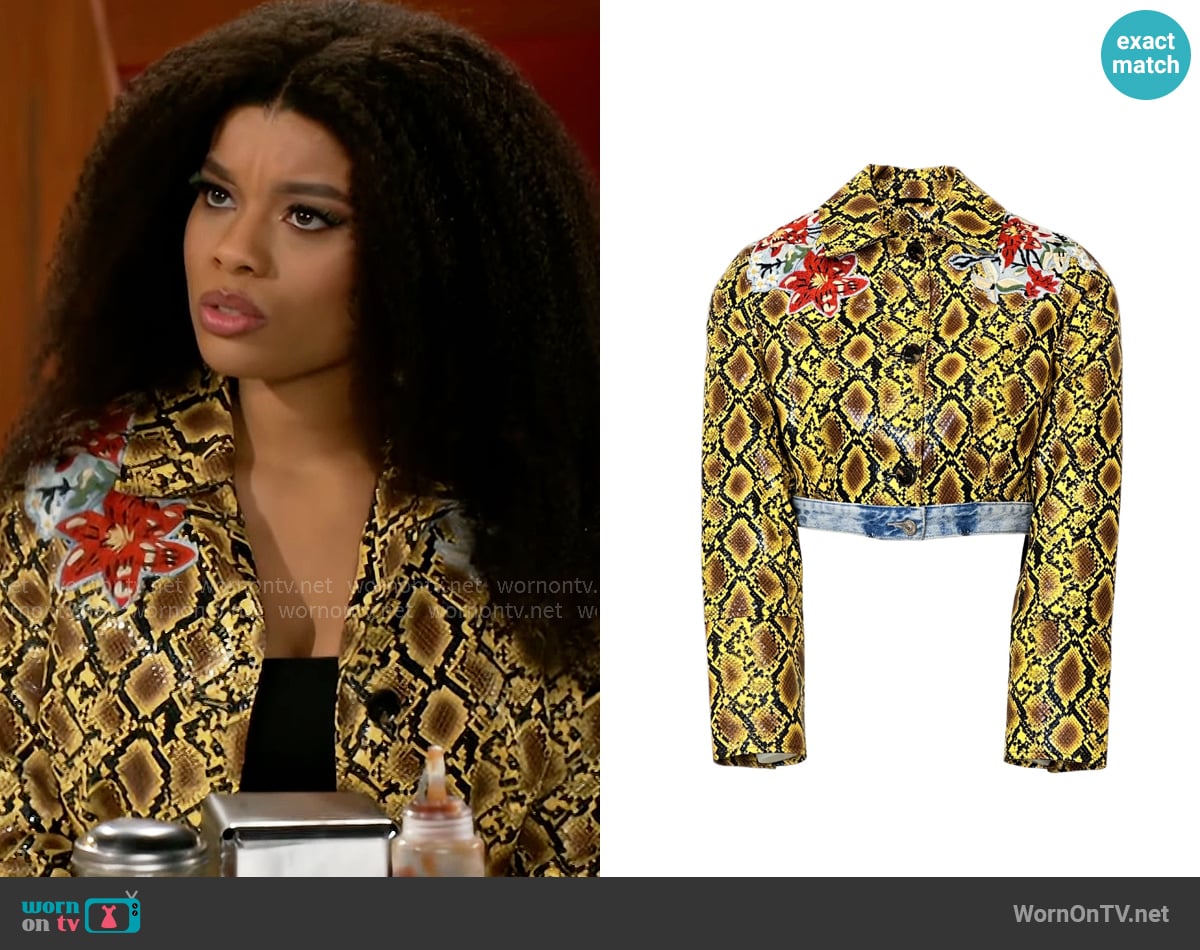 Eva’s yellow snake and flower print jacket on Beyond the Gates Eva’s yellow snake and flower print jacket on Beyond the Gates