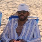 Danny's blue striped beach shirt and bucket hat on The Four Seasons
