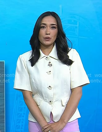 Emilie’s white short sleeve button front top and pink ruffle hem pants on Today