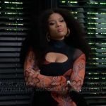 Eva’s black and orange printed mesh dress on Beyond the Gates