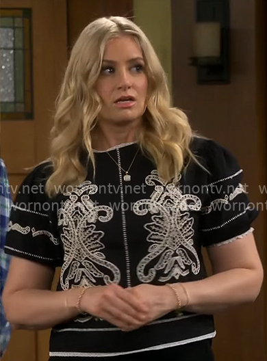 Gemma’s black and white embroidered top on The Neighborhood