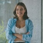 Hannah’s white knit scalloped top on Off Campus