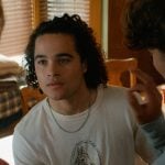 John’s beige horse graphic tee on Off Campus