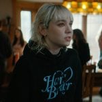 Jules’s black printed hoodie on Off Campus