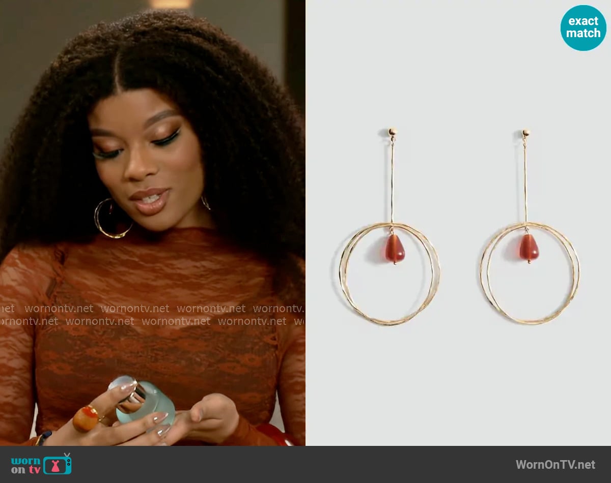 Mango Hanging hoop earrings with ball detail worn by Eva Thomas (Ambyr Michelle) on Beyond the Gates