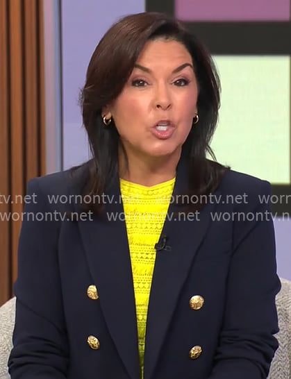 Meg Oliver’s navy blazer with gold buttons on CBS Evening News