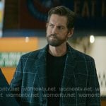Phil Graham’s black windowpane check coat on Off Campus