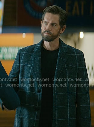 Phil Graham’s black windowpane check coat on Off Campus