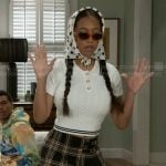 Samantha's white cable-knit top and plaid skirt on Beyond the Gates