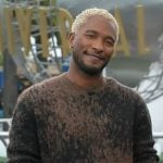 Scott’s brown knit sweater on Access Hollywood