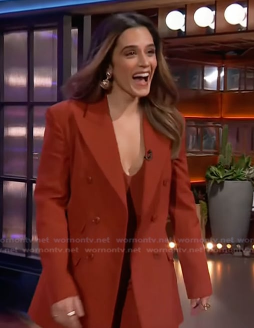 Sepideh Moafi’s orange double breasted suit on The Kelly Clarkson Show