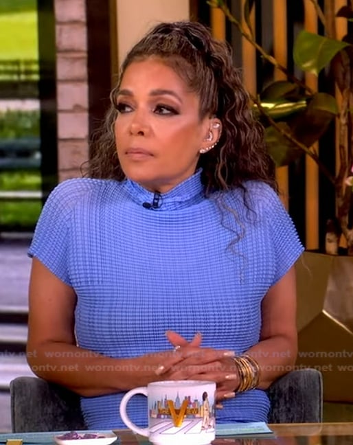 Sunny’s blue turtleneck knit top on The View