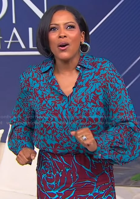 Tamron’s blue abstract print blouse and skirt on Tamron Hall Show