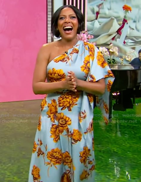 Tamron’s blue floral one shoulder dress on Tamron Hall Show