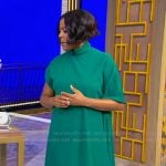 Tamron’s green asymmetric dress on Tamron Hall Show