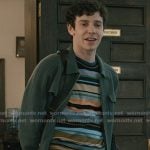 Teddy’s multicolor stripe sweater and green zip jacket on Elsbeth