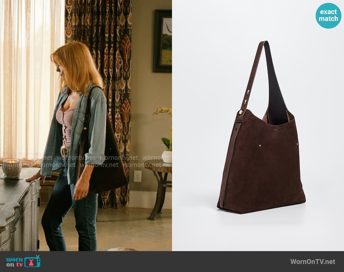 Tory Burch Romy Suede Hobo Bag worn by Beth Dutton (Kelly Reilly) on Dutton Ranch