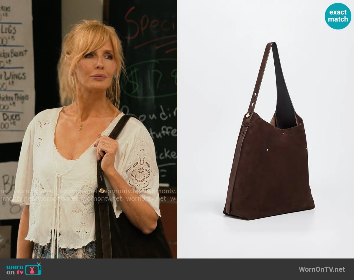 Tory Burch Romy Suede Hobo Bag worn by Beth Dutton (Kelly Reilly) on Dutton Ranch