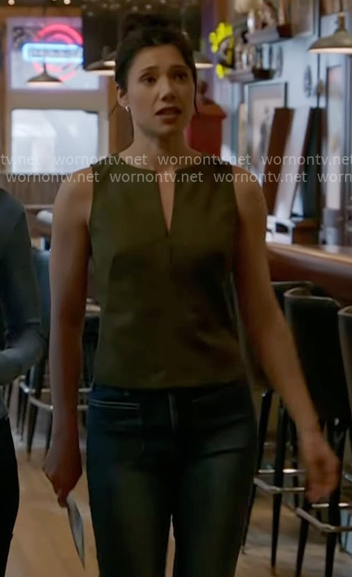 Violet’s olive green split-neck top on Chicago Fire