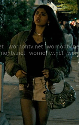 Abby’s black knit top, green bomber jacket and patchwork mini skirt on Not Suitable For Work