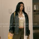 Abby's green floral corset, oversized leather jacket, olive pants, and yellow bag on Not Suitable For Work