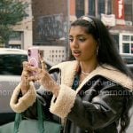 Abby’s leather and shearling jacket with green bag on Not Suitable For Work