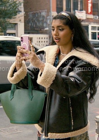 Abby’s leather and shearling jacket with green bag on Not Suitable For Work