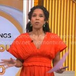 Adriana Diaz’s orange v-neck smocked waist dress on CBS Mornings