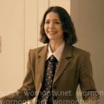 AJ’s brown tie-neck blouse and olive blazer on Not Suitable For Work