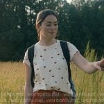 Annie’s white labybug print tee and red pants on Sweet Magnolias